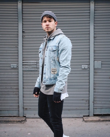 Men's hoodie outfit styling with denim jacket