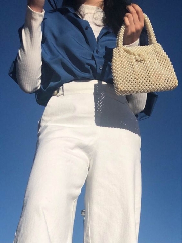 Pearl handbag is the interesting highlight for the outfit Pearl handbag is the interesting highlight for the outfit