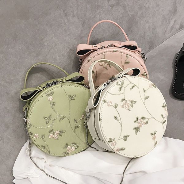 Round fashion handbag for women crossbody with embroidered flowers Round fashion handbag for women crossbody with embroidered flowers