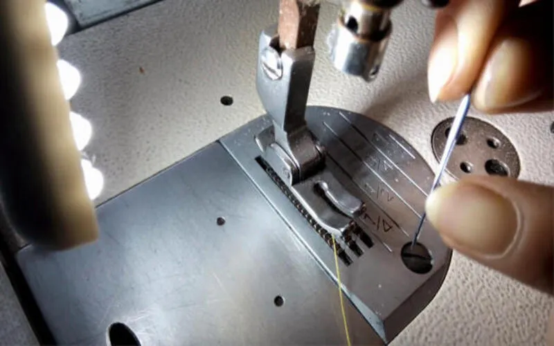 tightening backpack needle holding screw