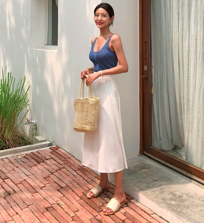 Wear two-strap crop top combined with fitted skirt